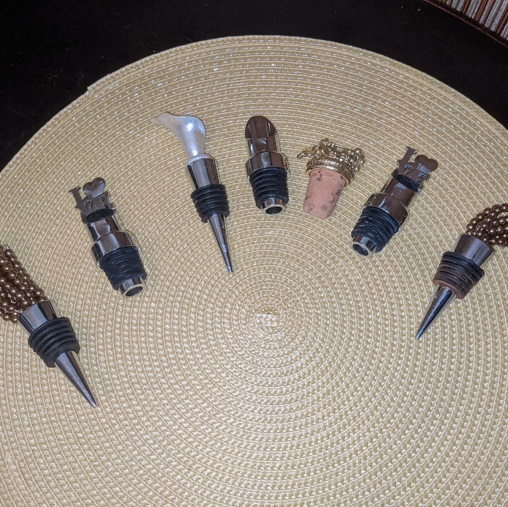 Lot of wine stoppers and aerator
